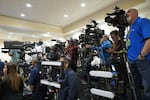 In this photo, members of the media with video cameras on tripods cover a roundtable that former President Donald Trump participated in on Oct. 22 in Doral, Florida.