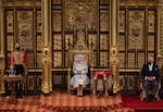 May 11, 2021: Britain's Queen Elizabeth II reads the Queen's Speech on the The Sovereign's Throne, as Britain's Prince Charles, Prince of Wales (right) listens, in the House of Lords chamber, during the State Opening of Parliament at the Houses of Parliament in London on , which is taking place with a reduced capacity due to Covid-19 restrictions.