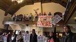 Members of Oregon State University's Coalition of Graduate Employees picket at a winter celebration event on the Corvallis campus on Dec. 5, 2024.