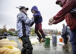 Before the races began, volunteers helped kids into the pumpkin boats who wanted to see what it was like to float in a giant vegetable. 