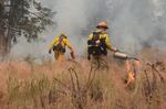 Fire crews working the Canyon Creek Complex burn out remaining fuel near structures to provide protection to structures and roads Wednesday, Aug. 19, 2015.