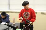 David Douglas High School senior Jayee Li works on a model rocket in an after-school class. It's part of the high school's Schools Uniting Neighborhoods, or SUN, program.