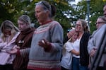 Laura Williquette, right, holds her daughter, Brynn, 11, as she cries during a vigil at R.A. Long Park for the victims of the Nippon Dynawave Packaging Co. chemical tank failure in Longview, Wash., on May 26, 2026.