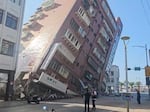 In this image taken from a video footage run by TVBS, a partially collapsed building is seen in Hualien, eastern Taiwan on Wednesday, April 3, 2024. A powerful earthquake rocked the entire island of Taiwan early Wednesday, collapsing buildings in a southern city and creating a tsunami that washed ashore on southern Japanese islands.