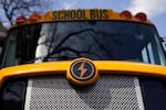 FILE: A Lion electric school bus is seen on display in Austin, Texas, Feb. 22, 2023. The Bipartisan Infrastructure Law passed in 2021 included $5 billion for cleaner school buses.