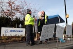 Striking machinists at Boeing picket outside the company's Renton Production Facility in Washington. Some 33,000 workers walked off the job in September demanding higher pay and better retirement benefits. Union members have voted down two previous contract offers from Boeing ahead of Monday's vote.