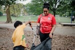 Townsend and her son, Khalib, go on a "trash walk" to pick up trash at Clark Park in Philadelphia. Photograph by Hannah Yoon