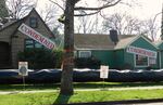 Two of six houses symbolically condemned as part of Mary DeMocker's art installation.