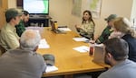 Monument Ranger Rebecca Hoffman (top right) and her staff at a meeting on Sept. 23, 2019, at Mount St. Helens National Volcanic Monument in the Gifford Pinchot National Forest in Washington. The forest is part of the U.S. Forest Service Region 6, which will lose its regional headquarters under a new plan from the U.S. Department of Agriculture.