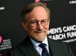 A photo of Steven Spielberg's shoulders and face. He's wearing a suit and tie.