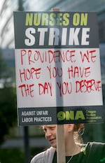 Aishia Sorbets, a registered nurse in the cardiac telemetry unit, pickets at Providence Portland Medical Center, June 19, 2023. 