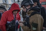 Danylo Reshetniak, 22, volunteers for a charity called Children New Generation. He registers people for evacuation from the city of Pokrovsk, where constant Russian bombardment has forced authorities to shut down electricity, gas and running water.