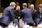 European Commission President Ursula von der Leyen, left, Ukraine President Volodymyr Zelenskyy, center, and European Council President Antonio Costa, center right, and  arrive for a round table meeting at an EU Summit in Brussels on Thursday.