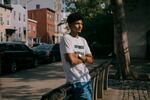 Elcoutoub, 21, an asylum-seeker from Mauritania, has has spent 20 days at the Clinton Hall shelter. He stands outside Washington Hall Park as he seeks relief from the congested confinements of 47 Hall St.