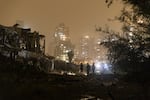 Israeli emergency responders inspect a scene of a direct ballistic missile hit, after it was launched from Iran on Thursday, in Petah Tikva, Israel. Iran has continued firing waves of drones and missiles at Israel after the U.S. and Israel launched a joint attack on Iran on Feb. 28.
