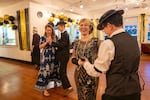 Buster Keaton Conference attendees Joy Blatchford (from left) dances with her son Aden Blatchford and Katrina Nguyen dances with her husband Khoi Nguyen at a 1920s themed dance in Cottage Grove, Ore. Aden, Katrina and Khoi are dressed in 1920s clothes.