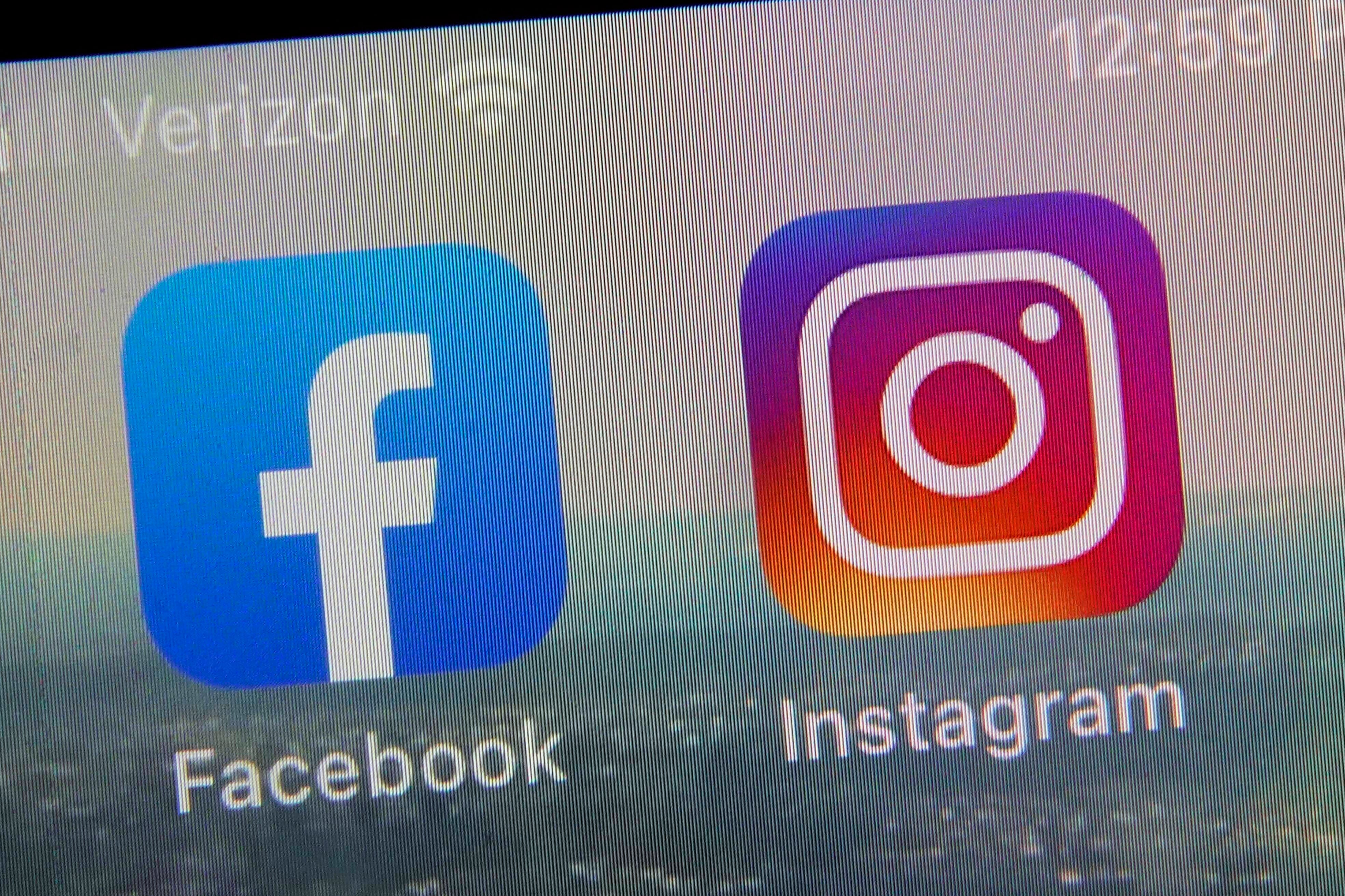 FILE - This photo shows the mobile phone app logos for Facebook, left, and Instagram, both owned by Meta.