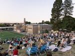 Crowds begin to gather at Chapman Elementary in Northwest Portland to watch thousands of Vaux’s Swifts gather overhead as they prepare to roost for the night in Portland, Oregon.