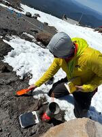 Kenton Fisher, with NASA’s Johnson Space Center, measures the amount of water in rocks by boiling them on camping stoves.