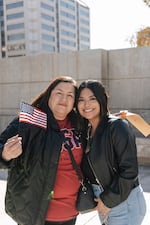 Sisters Olga Aguerra (left) and Nancy Tafolla stand outside the Sandra Day O'Connor Courthouse after Aguerra became a U.S. citizen.