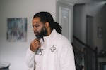 Edmund Garcia, an Iraq war veteran, listens to a phone call from the VA through his earpiece concerning his financial situation about his home.