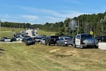 Law enforcement arrive as students are evacuated to the football stadium after the school campus was placed on lockdown at Apalachee High School in Winder, Ga., on Wednesday, Sept. 4, 2024.