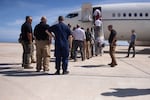 Members of a Congressional delegation depart after touring Guantánamo