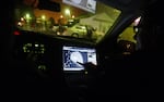 In this Dec. 31, 2008 file photo, engineer Stephan Noetzel alerts a police officer to gunshots using ShotSpotter, strategically placed acoustic sensors designed to help police track gunfire in East Palo Alto, Calif. 