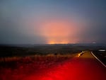 In this image provided by the Oregon Department of Transportation, the Durkee Fire burns in the background as it nears Interstate 84 near Huntington, Ore., early Sunday, July 21, 2024.
