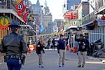 Law enforcement officers from multiple agencies work the scene on Bourbon Street after a person drove a truck into the crowd.