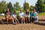 Farrell Lucei-Bryant, Warm Springs, (center) poses with her family. Lucei-Bryant is the grand-niece of former Water Ceremony leader and organizer, the late Art McConville. Since his passing, she has helped keep his legacy of healing the water alive.