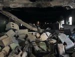 A boy sits on the rubble left from the Gaza City School airstrike on May 27, 2025.