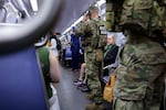 National Guard troops ride the Washington Metro in April.