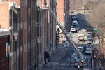 Firefighters ride in an aerial ladder as they inspect buildings damaged in a Christmas Day explosion Monday, Dec. 28, 2020, in Nashville, Tenn. Federal officials now turn to exploring the monumental task of piecing together the motive behind the bombing that severely damaged dozens of downtown Nashville buildings and injured three.