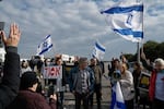 Israeli activists block the exit of Ashdod port to stop trucks carrying humanitarian aid destined for Gaza, in Ashdod, Israel, on Thursday, Feb. 1.