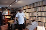 Aadam Jacobs poses in front of LP (long play) record storage bookcase at his home in Chicago, Thursday, March 19, 2026.