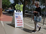 A sign directs voters to cast their ballots on April 1 at a polling station set up at the Flagler County Public Library in Palm Coast, Fla.