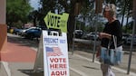 A sign directs voters to cast their ballots on April 1 at a polling station set up at the Flagler County Public Library in Palm Coast, Fla.