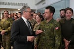 Britain's Prime Minister Keir Starmer speaks to a Canadian Lt Colonel as he visits a military base to meet planners mapping out next steps in the Coalition of the Willing in Northwood, London on Thursday.