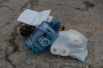 Supplies are left in a parking lot for those living in a tent encampment in Chicago's Gompers Park.