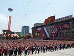 In this pool photograph distributed by the Russian state agency Sputnik, people release balloons in the air as Vladimir Putin and Kim Jong Un attend a welcoming ceremony at Kim Il Sung Square in Pyongyang on June 19. Putin enjoyed a red carpet welcome, a military ceremony and an embrace from North Korea's Kim Jong Un during the state visit.