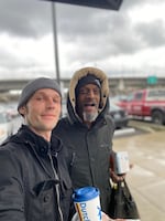 Caleb Ruecker with his friend Leroy Sly Scott, a houseless Portlander who died in 2020. For years, Scott could be found around the Sunnyside neighborhood. A new mural by the Portland Street Art Alliance commemorates his life.