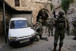 Israeli soldiers take up positions during an army raid in the West Bank town of Nablus, Feb. 11, 2026.