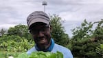 Malcolm Shabazz Hoover, co-founder and co-director of the Black Futures Farm in Southeast Portland, shows off some fresh greens.