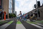 Annie Rudwick bikes to work with her daughters.