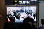 A TV screen shows an image of soldiers believed to be from North Korea standing in line to receive supplies from Russia during a news program at Seoul Railway Station in Seoul, South Korea, Monday, Oct. 21, 2024.