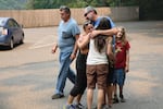 Eric Oftstie reunites with his wife Jenalee, 43; his son Ansel, 10; and their friend Heather Jeppesen.