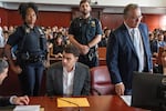 Luigi Mangione appears for a pre-trial hearing at Manhattan Criminal Court in New York, on Tuesday. In federal court, Mangione pleaded guilty on federal stalking charges.
