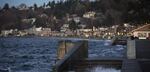 Water spills over a set of stairs that typically lead to the beach during a King Tide at Alki Beach Park on Tuesday, December 5, 2017, in West Seattle. 