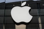 FILE - The Apple logo is illuminated at a store in Munich, Germany, April 2, 2026.